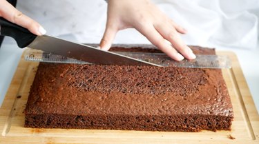 cutting the chocolate cake