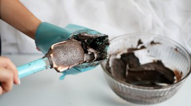 filling blue piping bag with chocolate buttercream